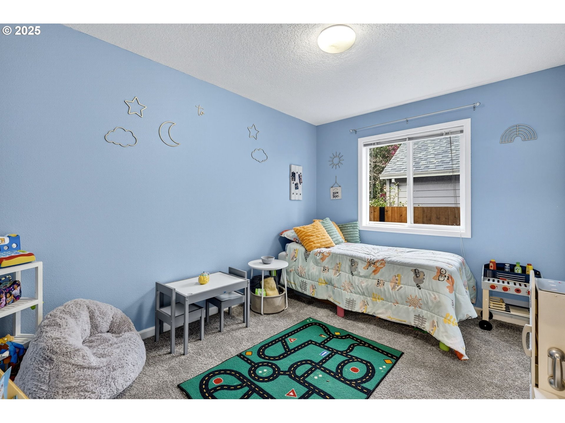 3915 Southeast 14th Street Gresham, OR 97080 - Photo 23 of 46 a bedroom with a bed window and a table