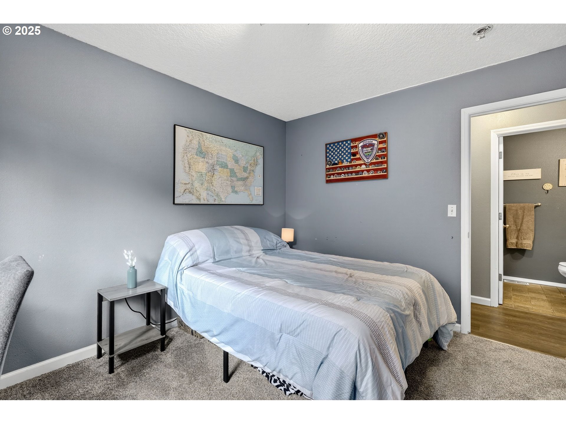 3915 Southeast 14th Street Gresham, OR 97080 - Photo 29 of 46 a bedroom with a bed and a painting on the wall