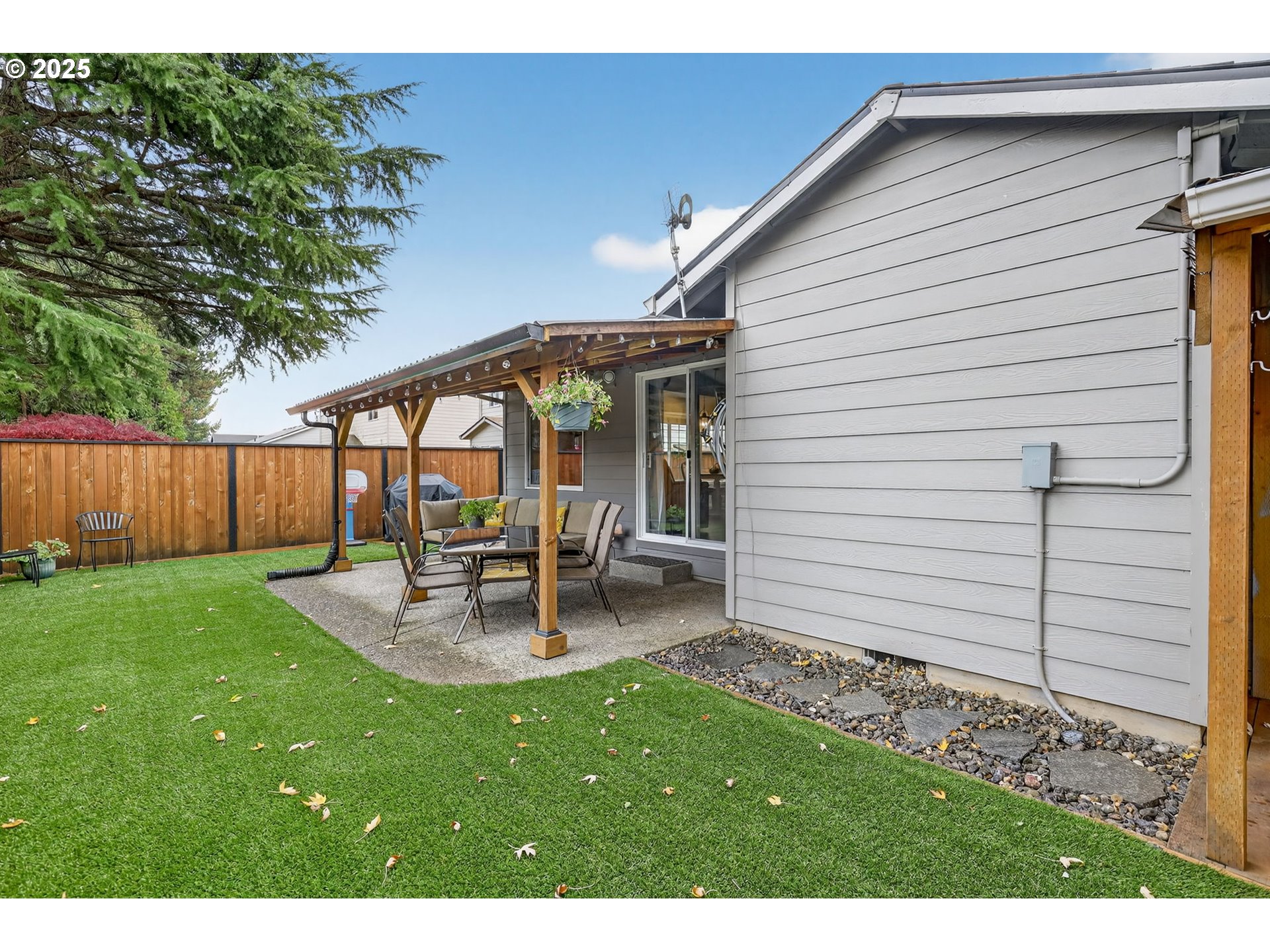 3915 Southeast 14th Street Gresham, OR 97080 - Photo 41 of 46 a backyard of a house with table and chairs