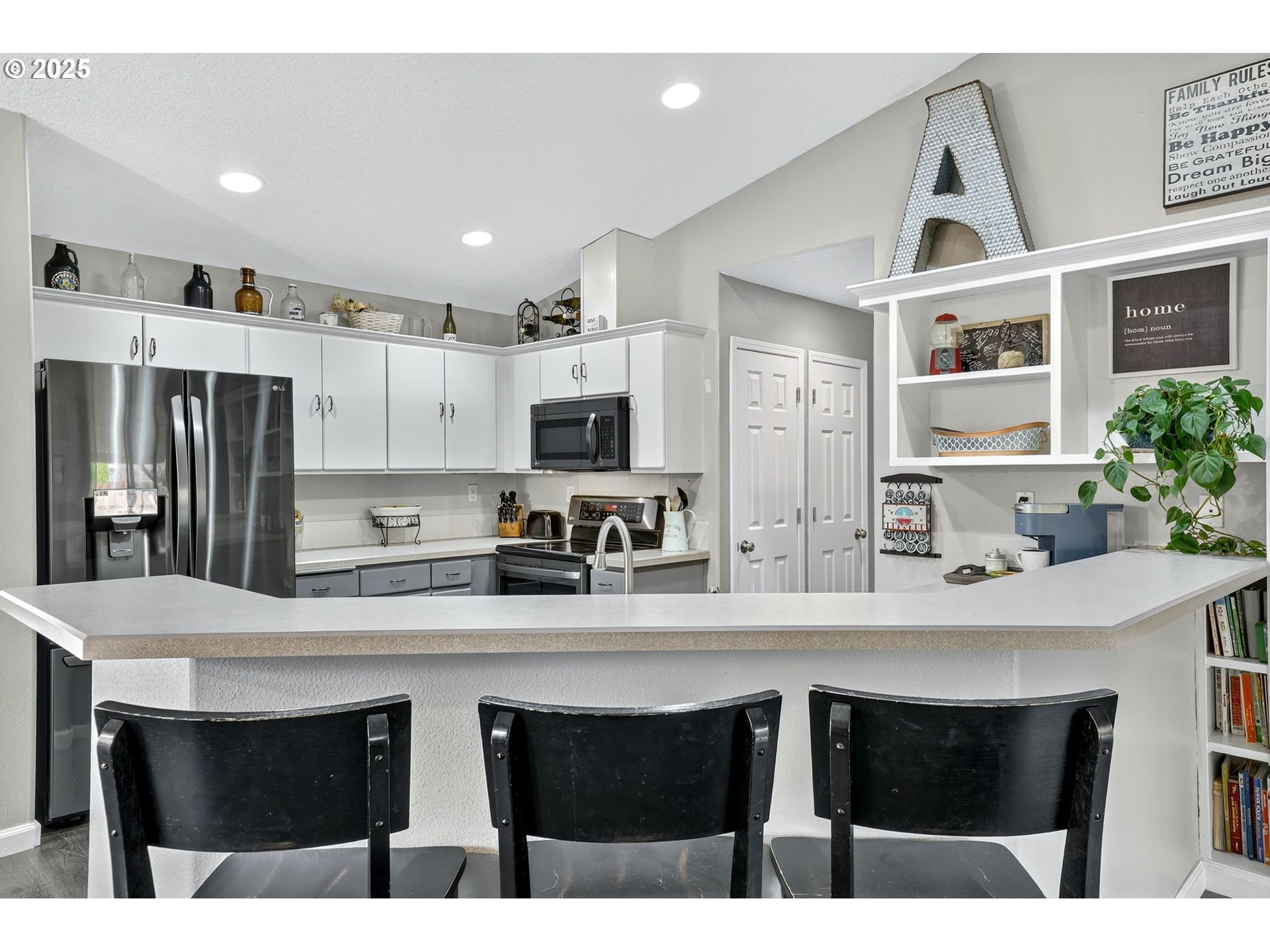 3915 Southeast 14th Street Gresham, OR 97080 - Photo 7 of 46 a kitchen with stainless steel appliances a sink stove refrigerator and cabinets
