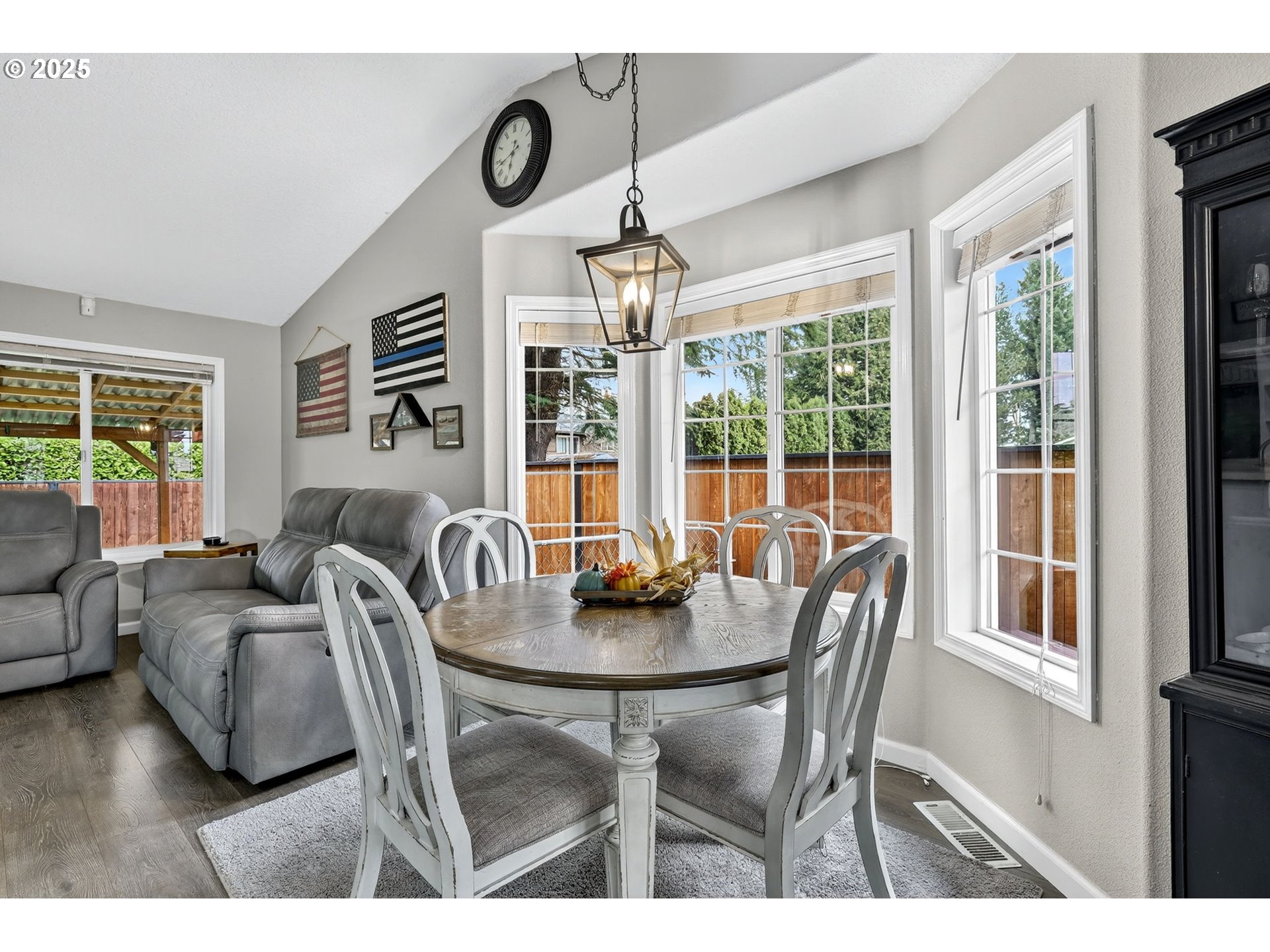 3915 Southeast 14th Street Gresham, OR 97080 - Photo 9 of 46 a dining room with furniture a chandelier and wooden floor