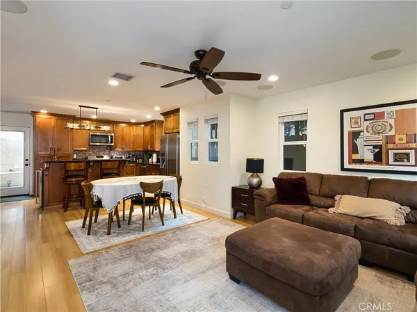 a large kitchen with a table and chairs