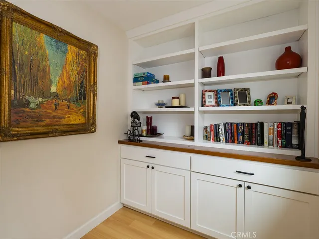 a bedroom with a bed a couch and a window