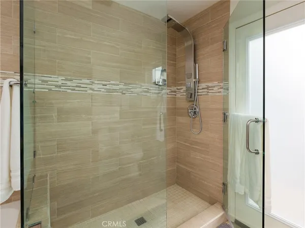 a bathroom with a bathtub and shower