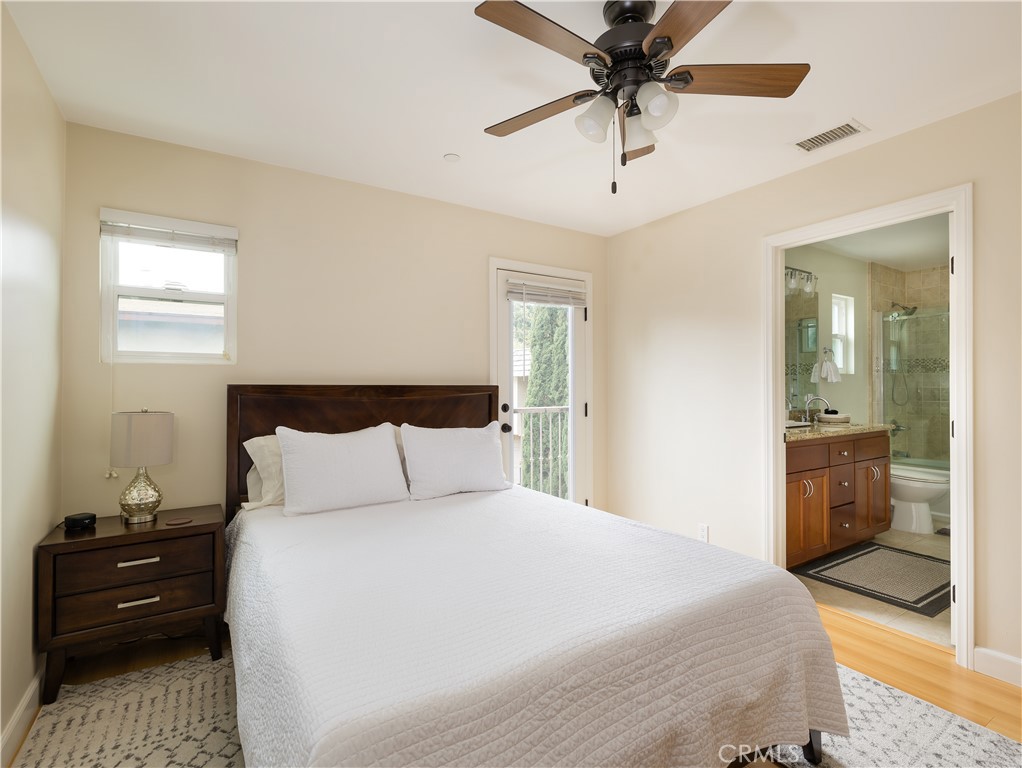 955 Virginia Street El Segundo, CA 90245 - Photo 33 of 43 a bedroom with a bed and a chandelier