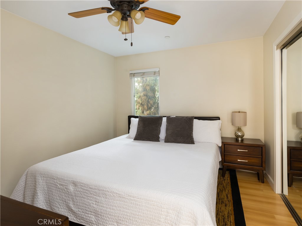 955 Virginia Street El Segundo, CA 90245 - Photo 35 of 43 a bedroom with a bed and a chandelier