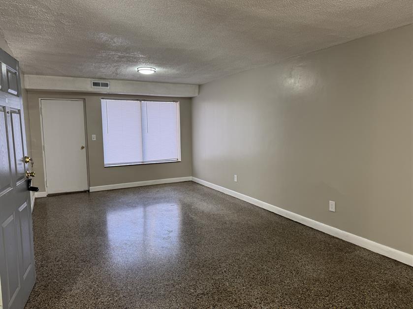 100 Ridgeview Lane, Unit 16 Bassett, VA 24055 - Photo 3 of 6 an empty room with wooden floor and windows
