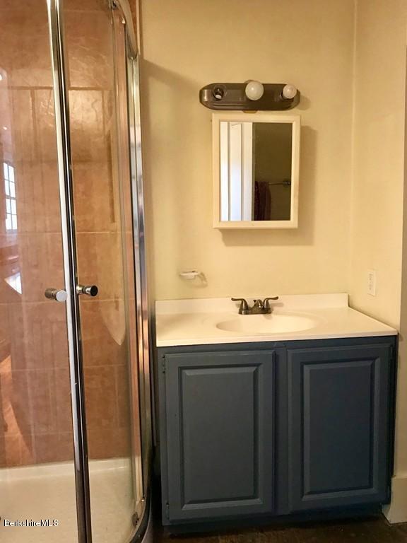 123 Frank Williams Road Shelburne, MA 01370 - Photo 20 of 30 a bathroom with a granite countertop sink and mirror