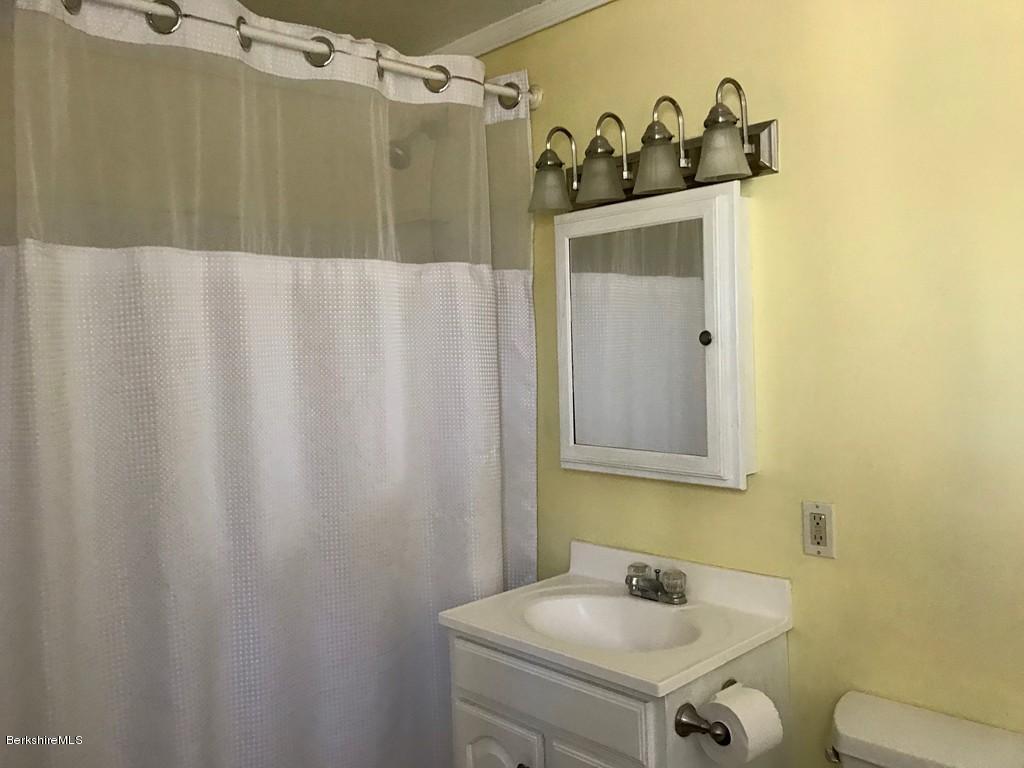 123 Frank Williams Road Shelburne, MA 01370 - Photo 21 of 30 a bathroom with a sink and mirror