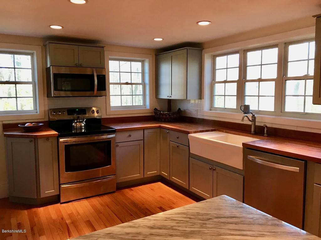 123 Frank Williams Road Shelburne, MA 01370 - Photo 7 of 30 a kitchen with a sink stove and microwave