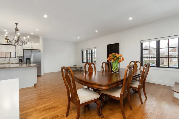 a dining room with furniture and wooden floor