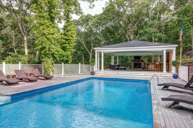 a view of house with yard outdoor seating and floor