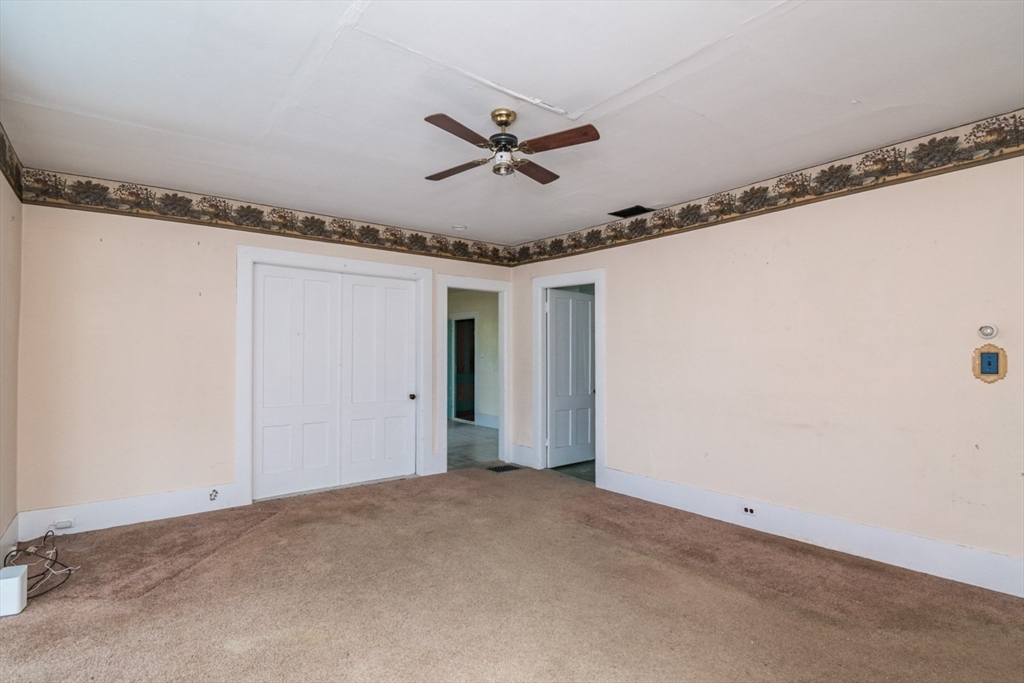 464 Main Road Gill, MA 01354 - Photo 13 of 41 a view of a livingroom and a ceiling fan