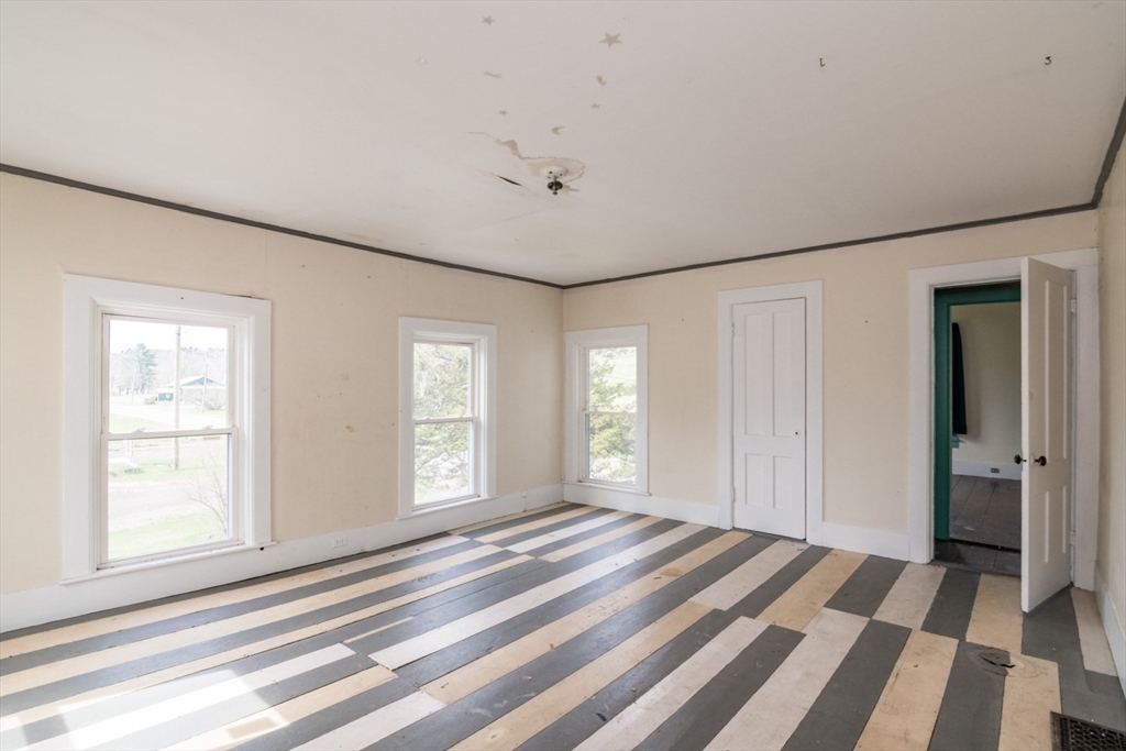464 Main Road Gill, MA 01354 - Photo 20 of 41 a view of a bedroom with wooden floor