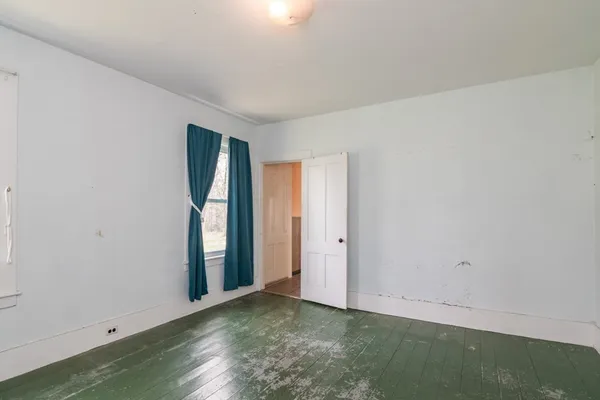 a view of an empty room and window