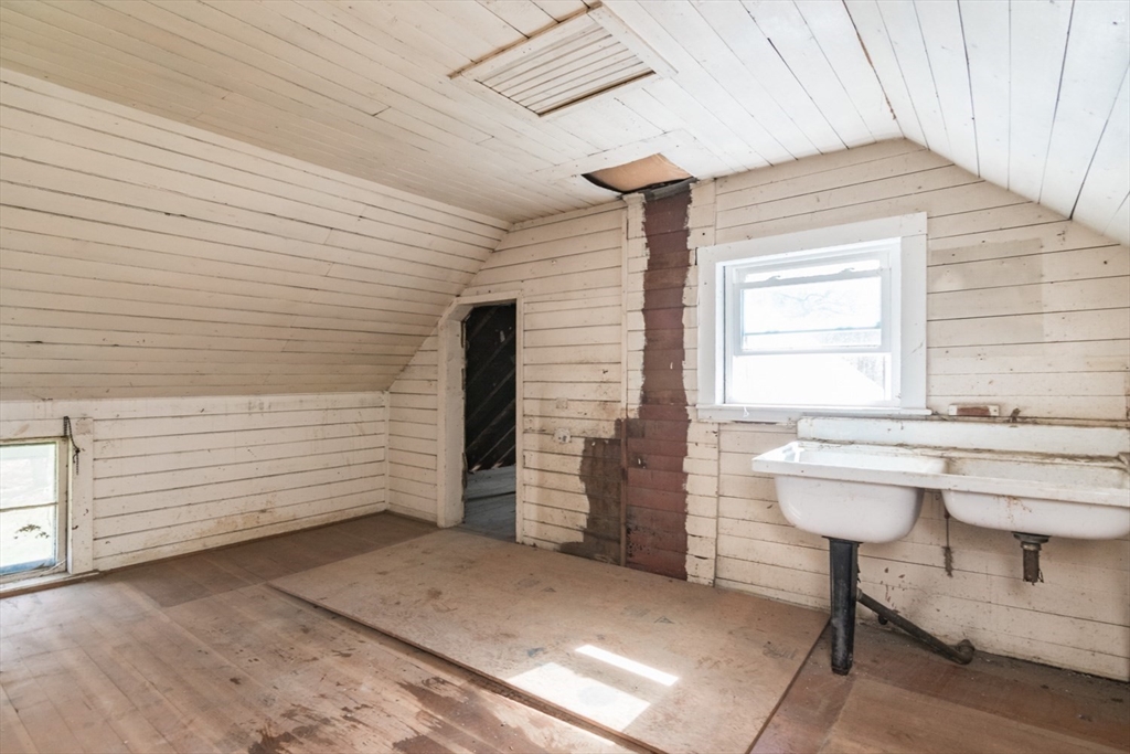 464 Main Road Gill, MA 01354 - Photo 28 of 41 a view of a bathroom with a sink and chairs
