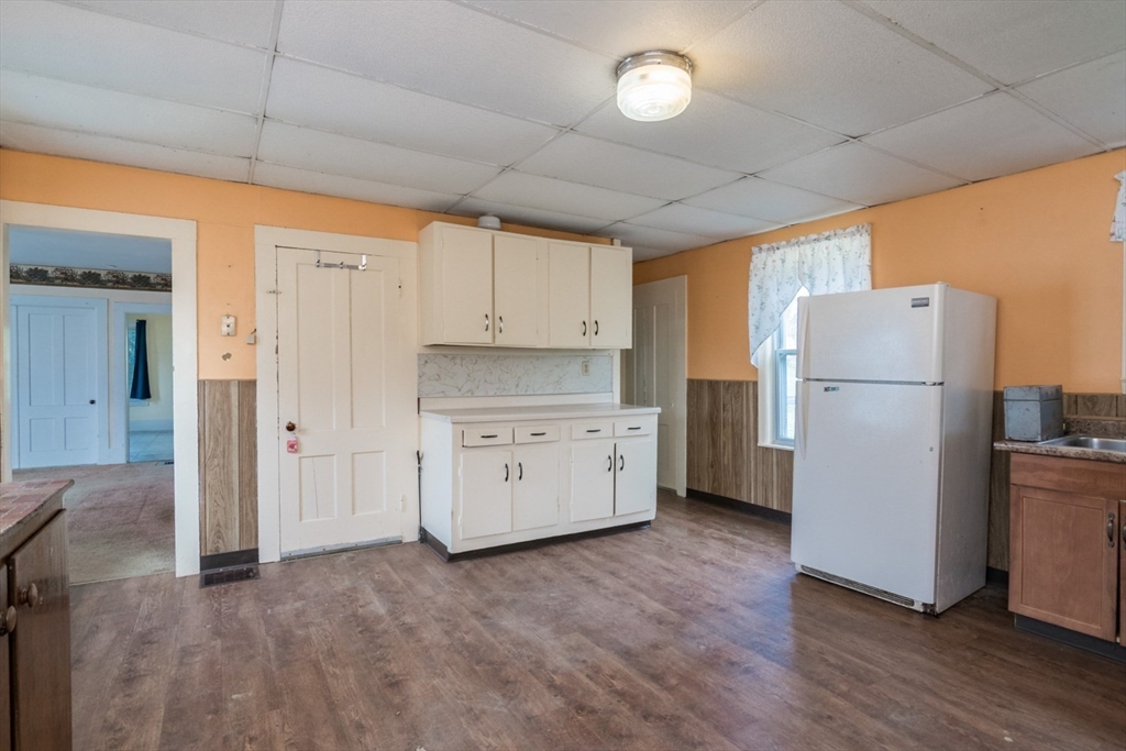 464 Main Road Gill, MA 01354 - Photo 8 of 41 a kitchen with refrigerator a stove top oven and a refrigerator