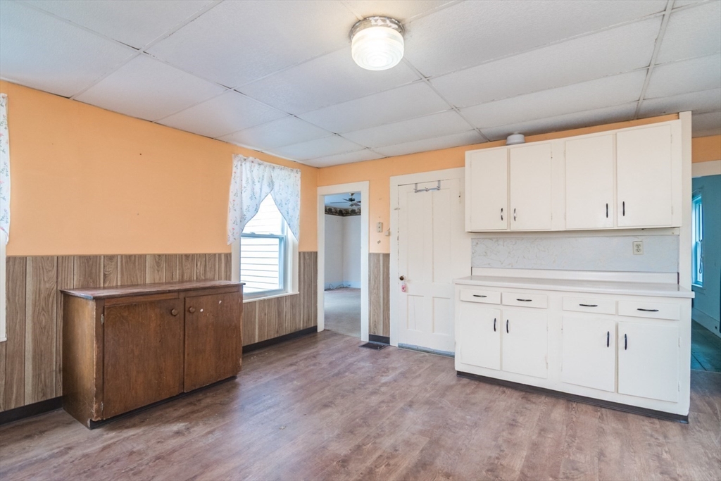 464 Main Road Gill, MA 01354 - Photo 9 of 41 a kitchen with granite countertop white cabinets and white appliances