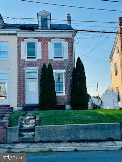 533 North Reading Avenue Boyertown, PA 19512 - Photo 1 of 15 Charming brick home with lush greenery.