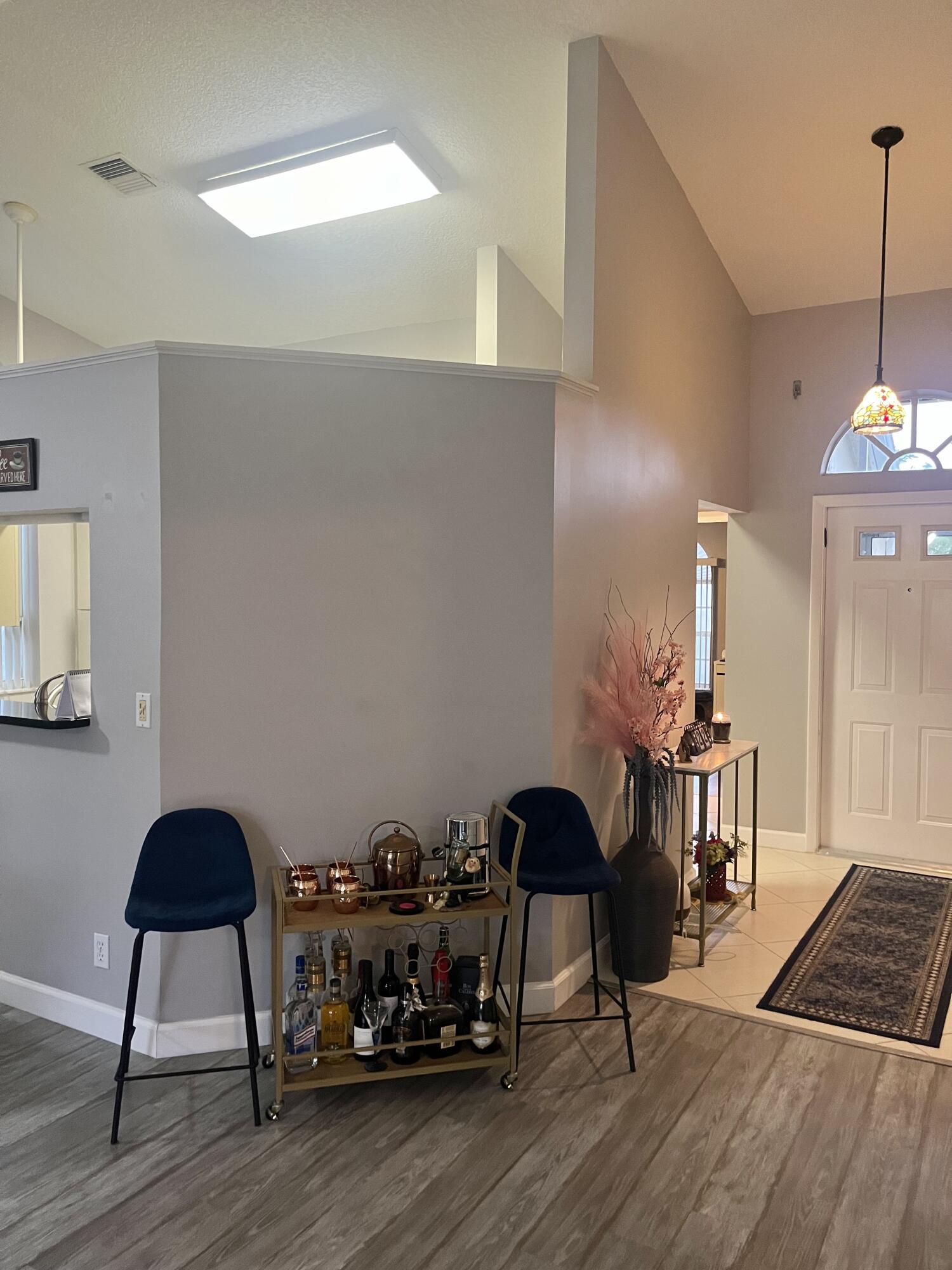 3502 Ridge Tree Court, Unit E Greenacres, FL 33463 - Photo 12 of 17 a view of a workspace with furniture and wooden floor