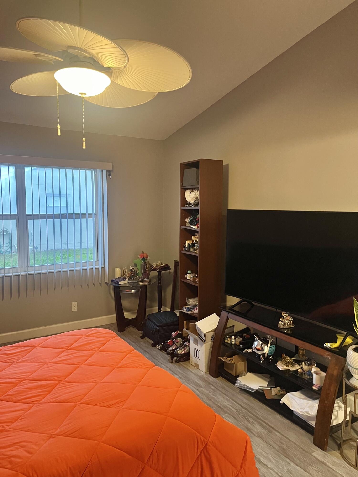 3502 Ridge Tree Court, Unit E Greenacres, FL 33463 - Photo 15 of 17 a room with furniture and a flat screen tv