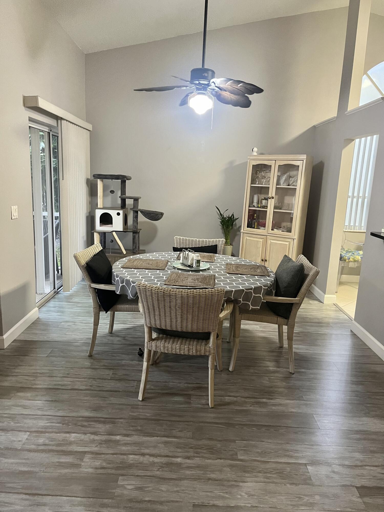 3502 Ridge Tree Court, Unit E Greenacres, FL 33463 - Photo 16 of 17 a view of a dining room with furniture window and wooden floor