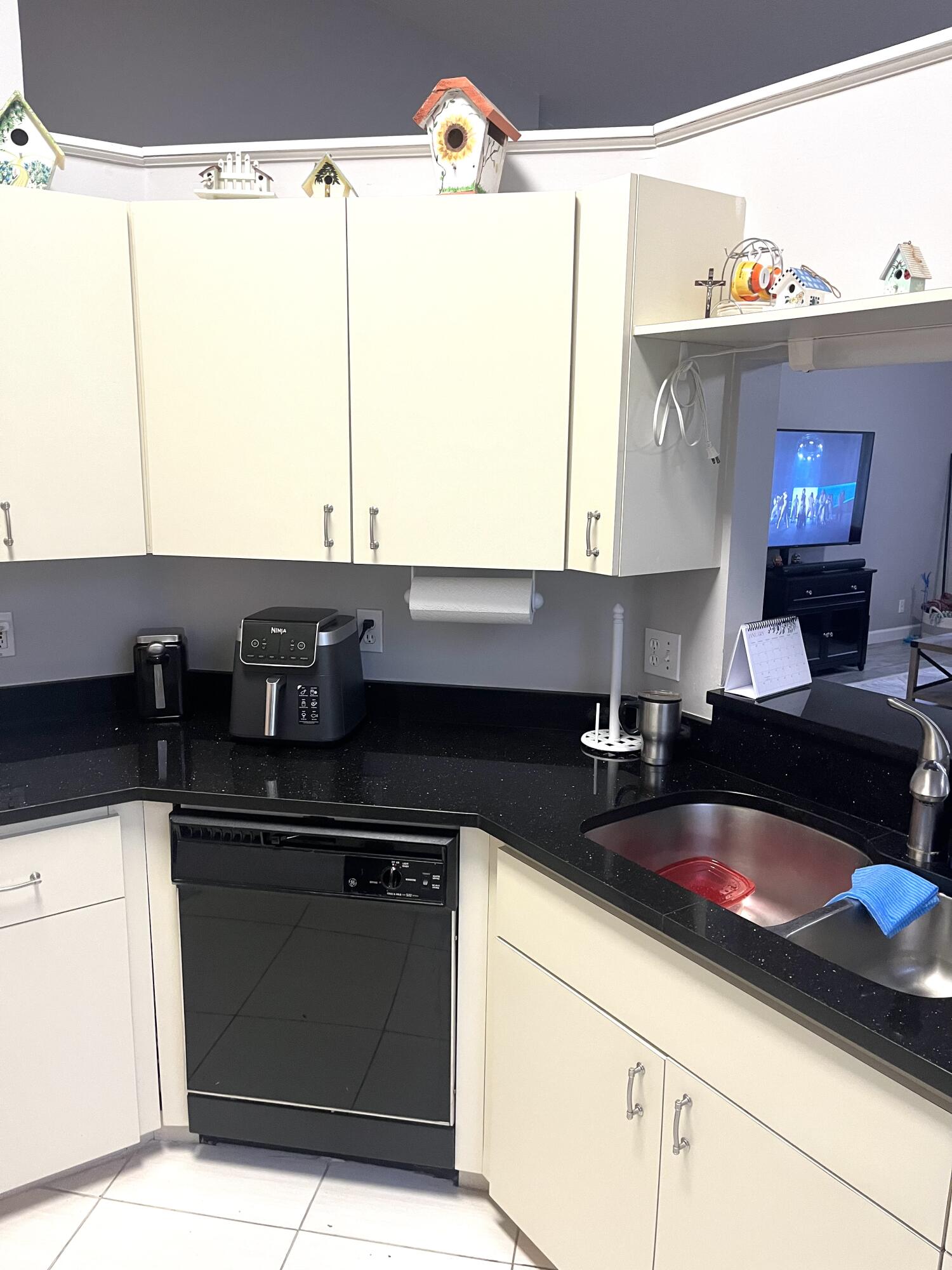 3502 Ridge Tree Court, Unit E Greenacres, FL 33463 - Photo 5 of 17 a kitchen with a sink and a stove