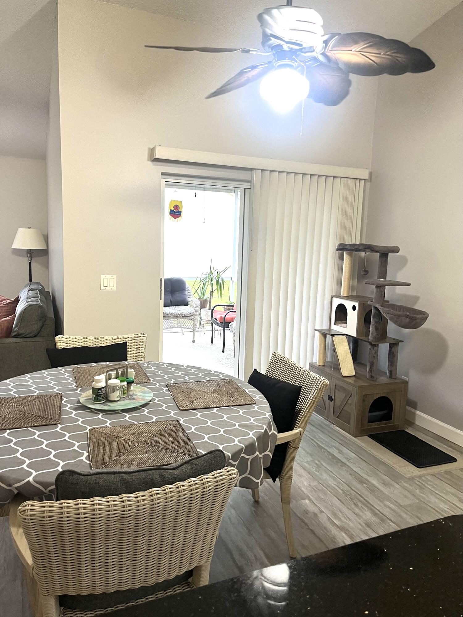 3502 Ridge Tree Court, Unit E Greenacres, FL 33463 - Photo 6 of 17 a bedroom with a bed and wooden floor