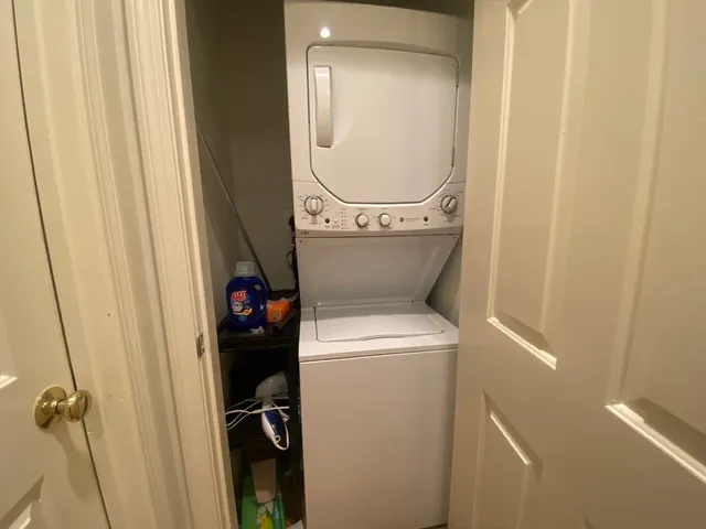 a close view of a utility room with dryer and washer