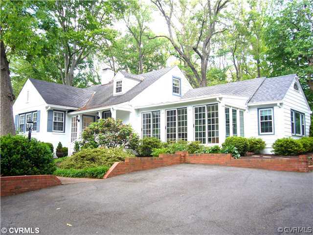 7328 Cherokee Road Richmond, VA 23225 - Photo 1 of 12 a front view of a house with a yard and outdoor seating