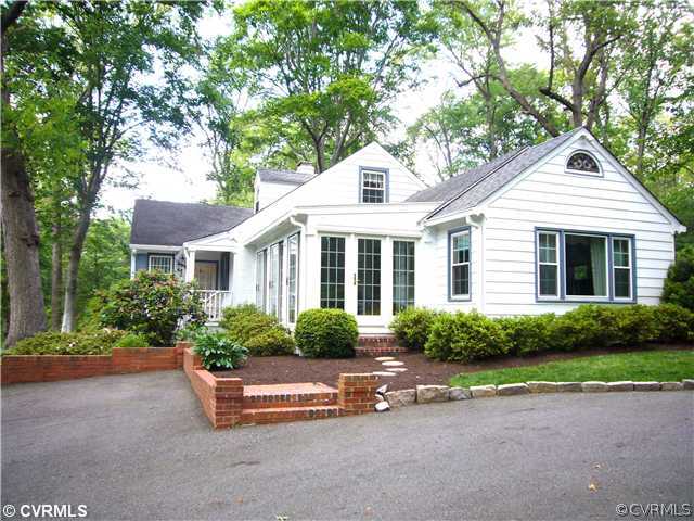 7328 Cherokee Road Richmond, VA 23225 - Photo 2 of 12 a front view of a house with a yard and outdoor seating