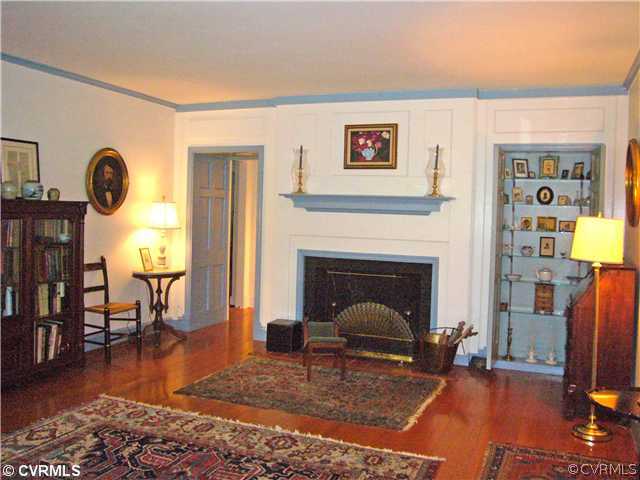 7328 Cherokee Road Richmond, VA 23225 - Photo 4 of 12 a living room with furniture rug and a fireplace