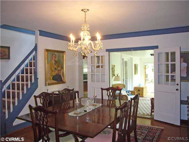 7328 Cherokee Road Richmond, VA 23225 - Photo 5 of 12 a view of a dining room with furniture and chandelier