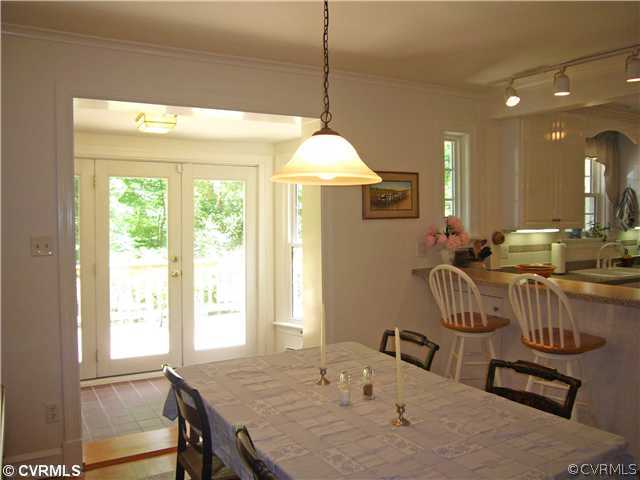 7328 Cherokee Road Richmond, VA 23225 - Photo 8 of 12 a dining room with furniture and window