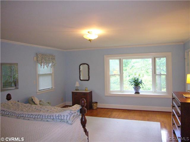7328 Cherokee Road Richmond, VA 23225 - Photo 10 of 12 a bedroom with a bed and a window
