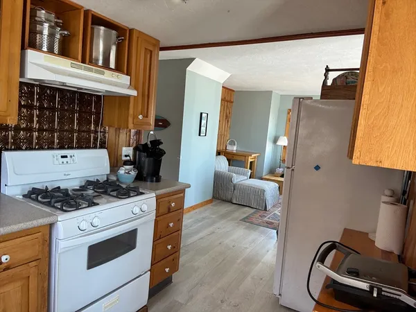 a kitchen with stainless steel appliances granite countertop a stove and a sink