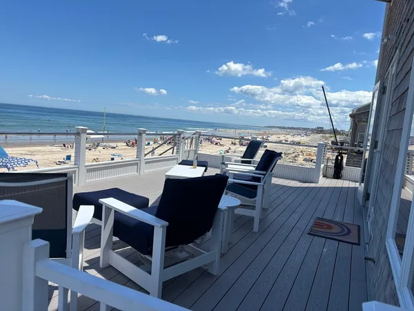 a view of a dining room with furniture wooden floor and chandelier