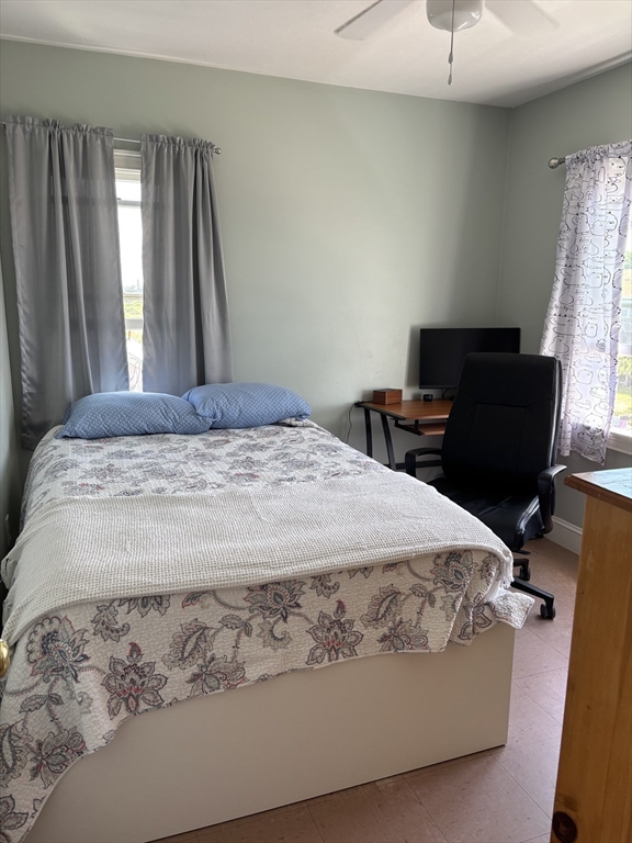 1 East Street Marshfield, MA 02050 - Photo 7 of 16 a bedroom with a bed and wooden floor