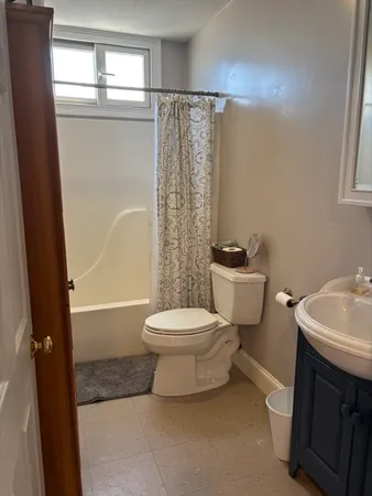 a bathroom with a toilet a sink and a bathtub