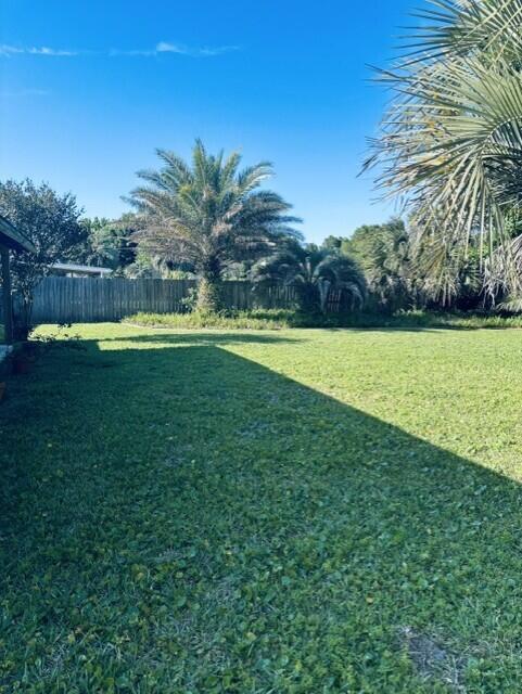 402 Juniper Street Destin, FL 32541 - Photo 17 of 20 a view of a big yard with a large trees