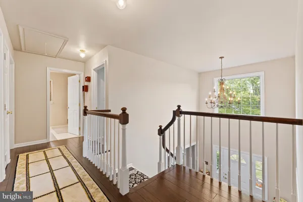 a bedroom with a bed and a ceiling fan
