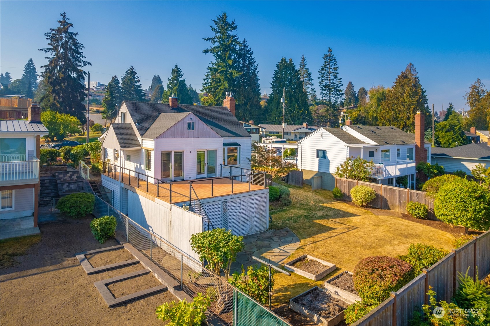 7544 South Sunnycrest Road Seattle, WA 98178 - Photo 11 of 40 an aerial view of a house with swimming pool and large trees