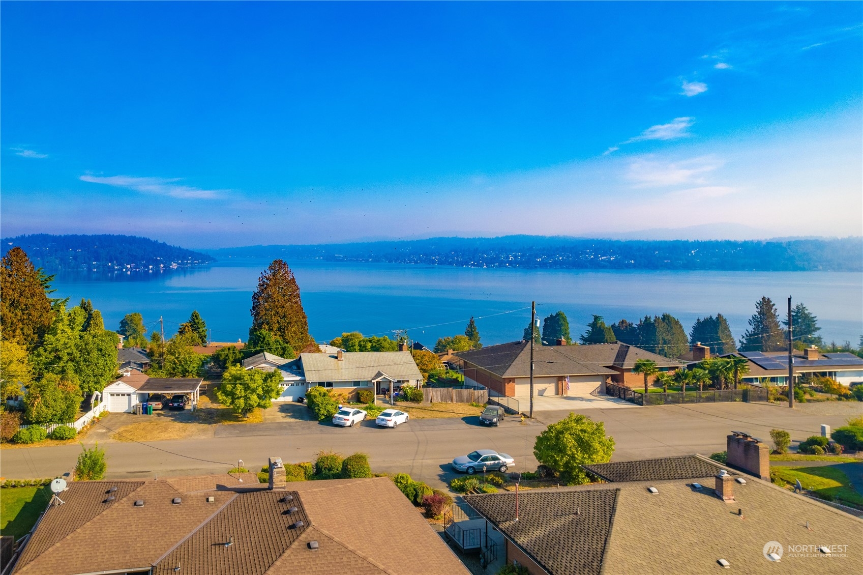 7544 South Sunnycrest Road Seattle, WA 98178 - Photo 7 of 40 an aerial view of a houses with a lake view