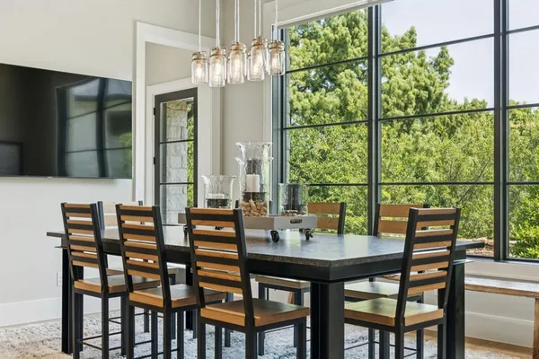 a view of a dining room with furniture window and outside view