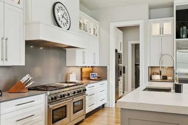 a kitchen with a stove and a refrigerator