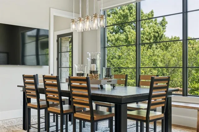 a view of a dining room with furniture window and outside view