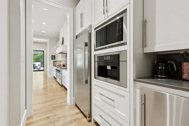 a view of a kitchen from the hallway