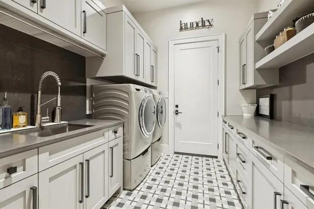 a kitchen with a sink and a refrigerator