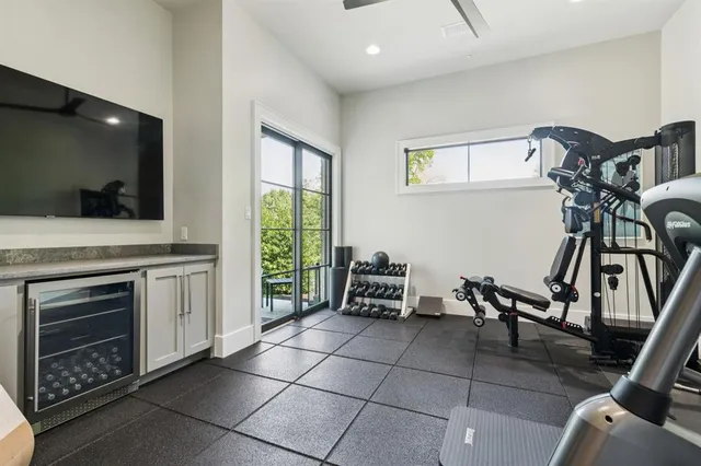 a dining room with furniture and a flat screen tv