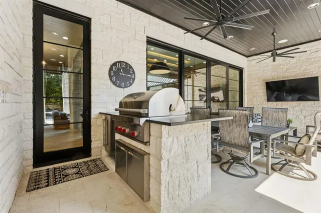 an aerial view of a house with a garden and lake view